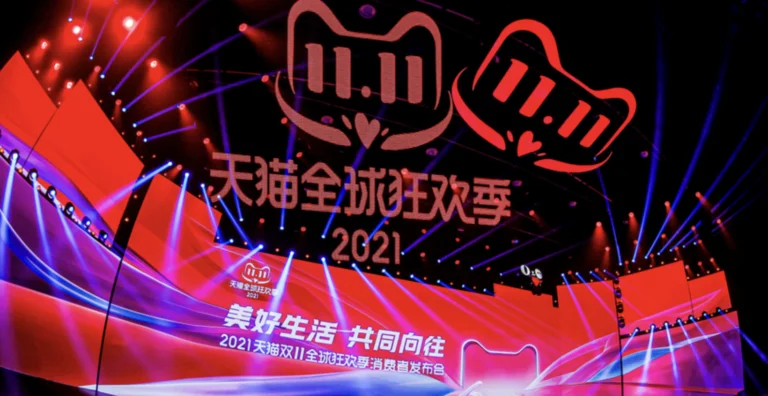 Tmall Double 11 Global Shopping Festival stage design featuring event branding, large screens, and immersive lighting effects.