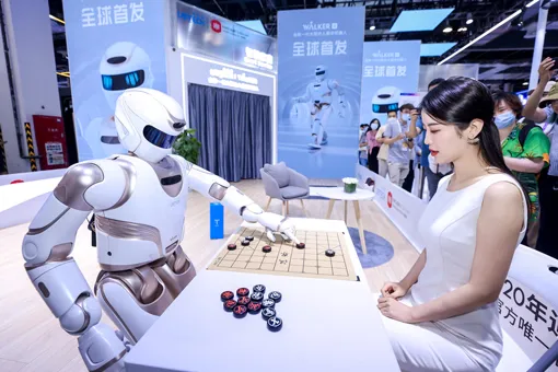 AI robot playing board game with woman