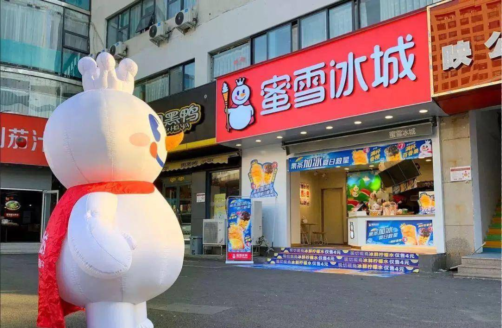 Mixue Ice Cream storefront with mascot