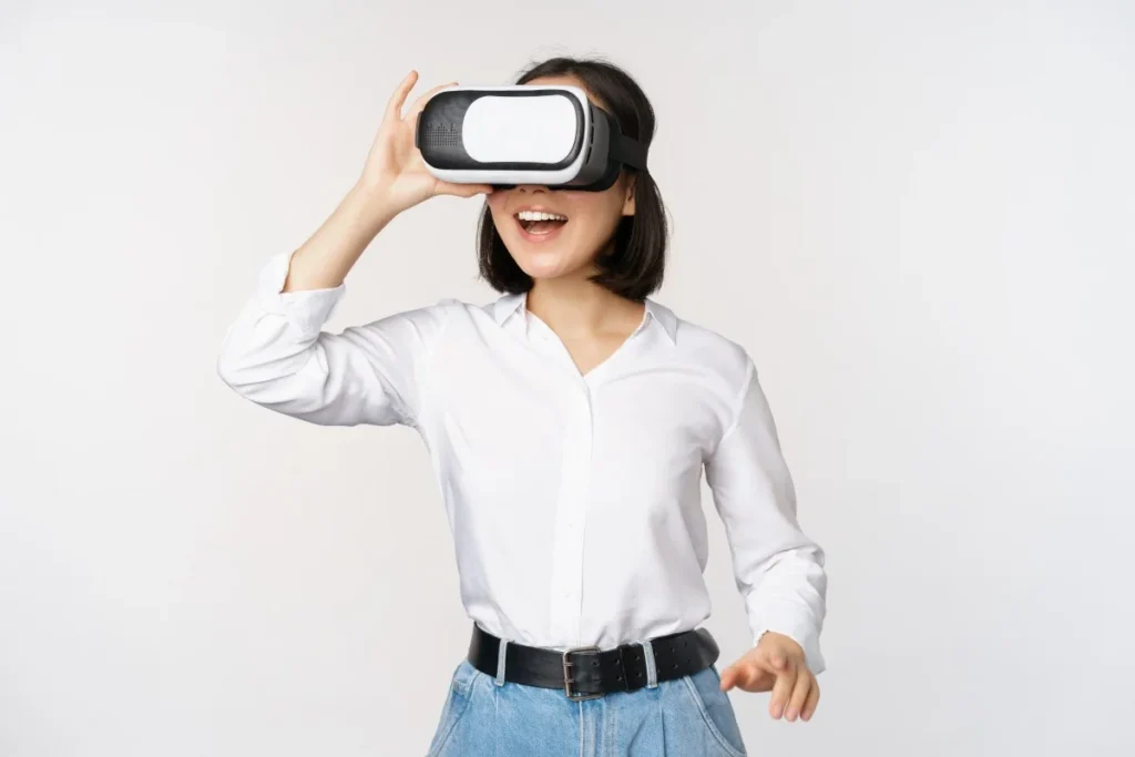 Woman using a virtual reality headset, representing immersive digital technology and future innovation.