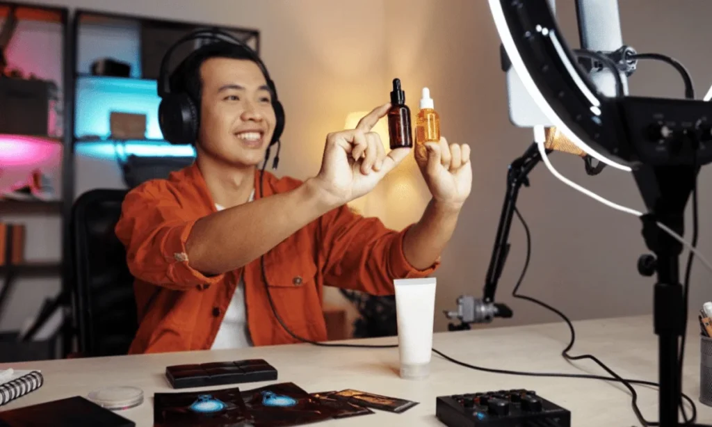 Live streamer presenting skincare bottles in front of ring light during online product demonstration