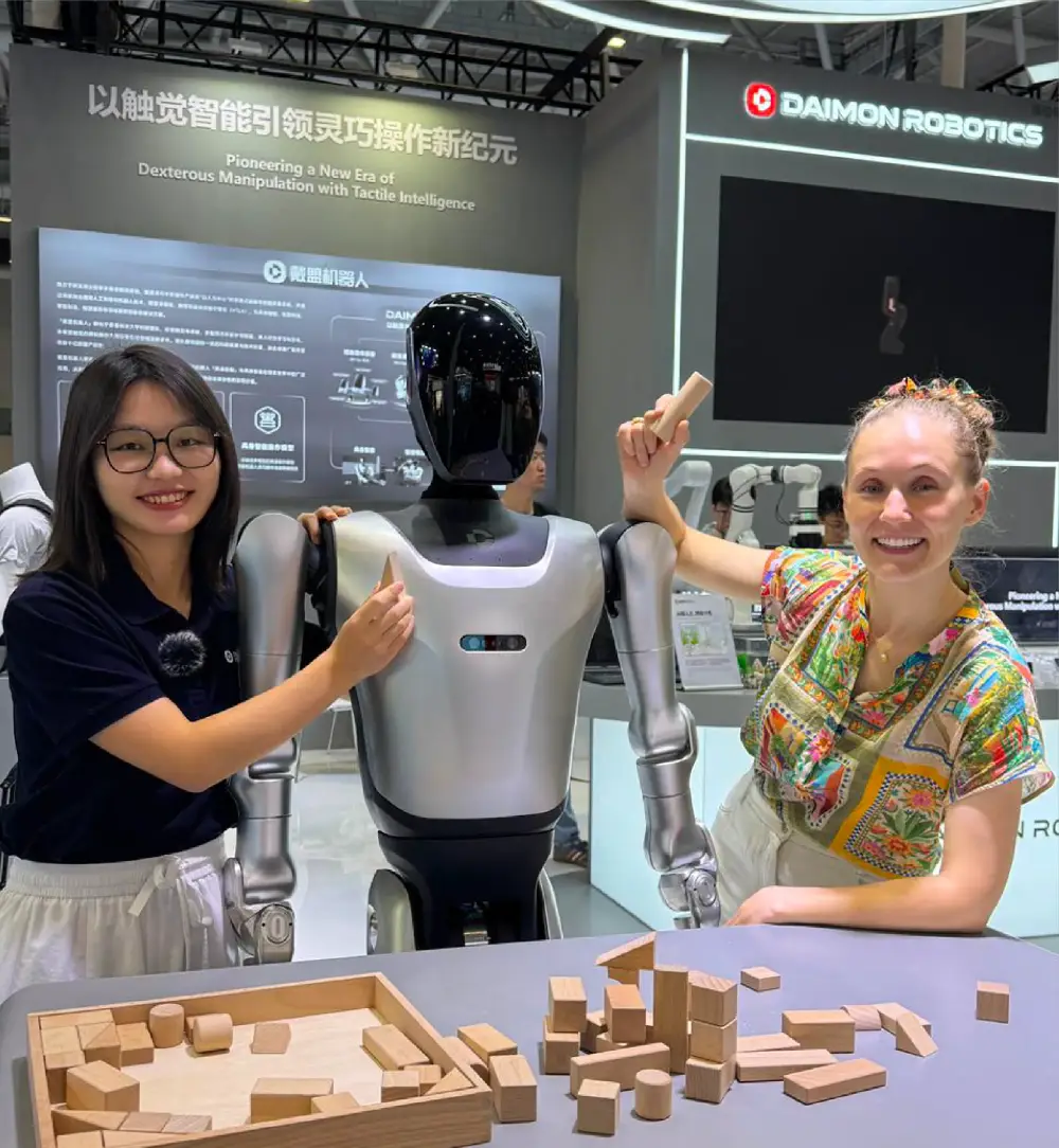 Ashley Dudarenok interacting with humanoid robot at Chinese robotics exhibition